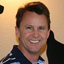 Dr. James T. Sumerfield, smiling, in a dark collared shirt